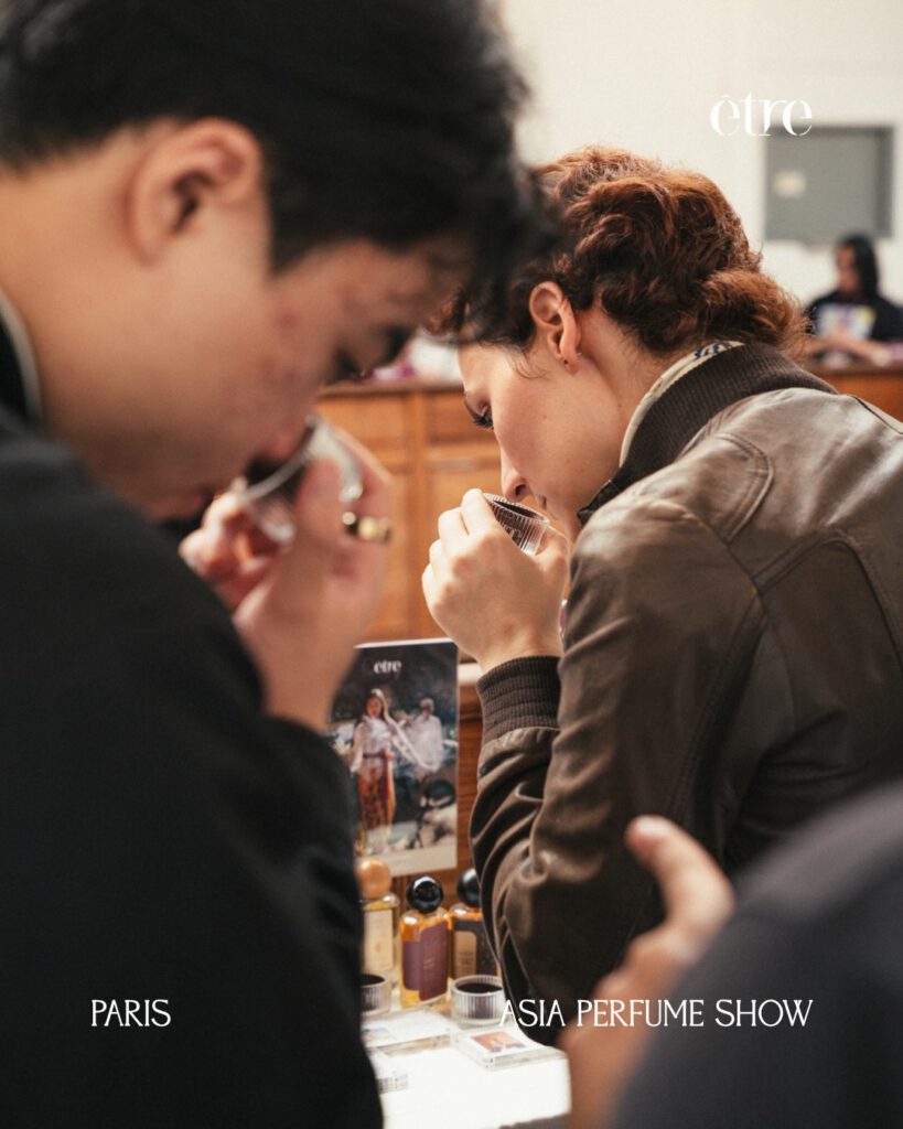 Visitors smelling ÊTRE fragrance strips at the Asia Perfume Show