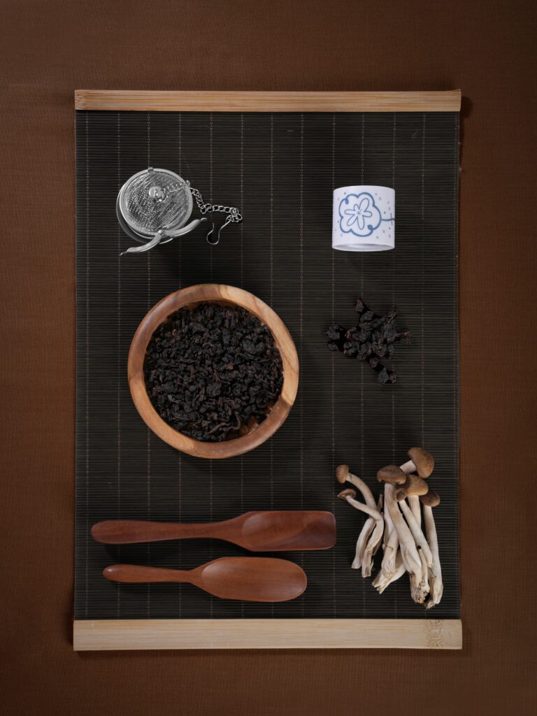 Yugen Kettle tea inspiration with tea leaves, mushrooms and a teacup